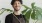 a person holding a potted plant